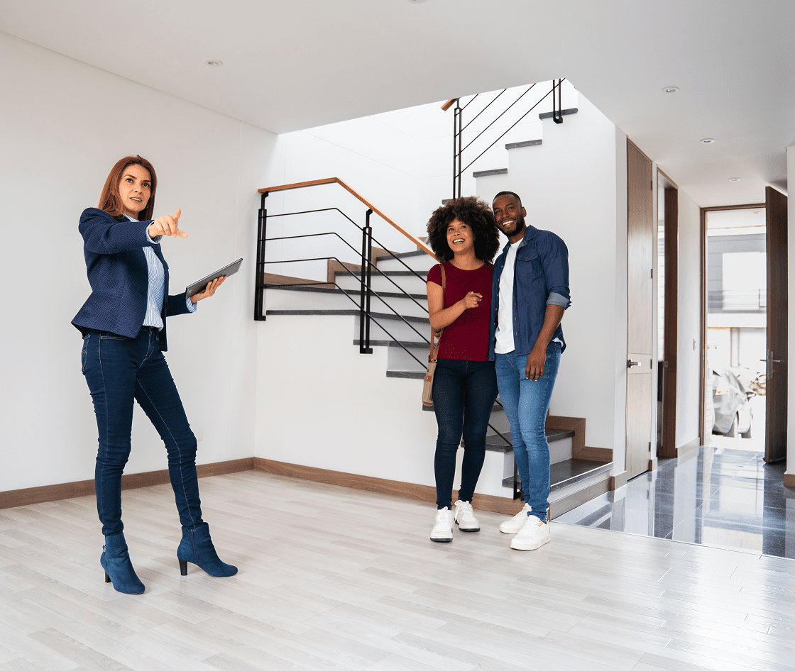 Couple touring modern house interior